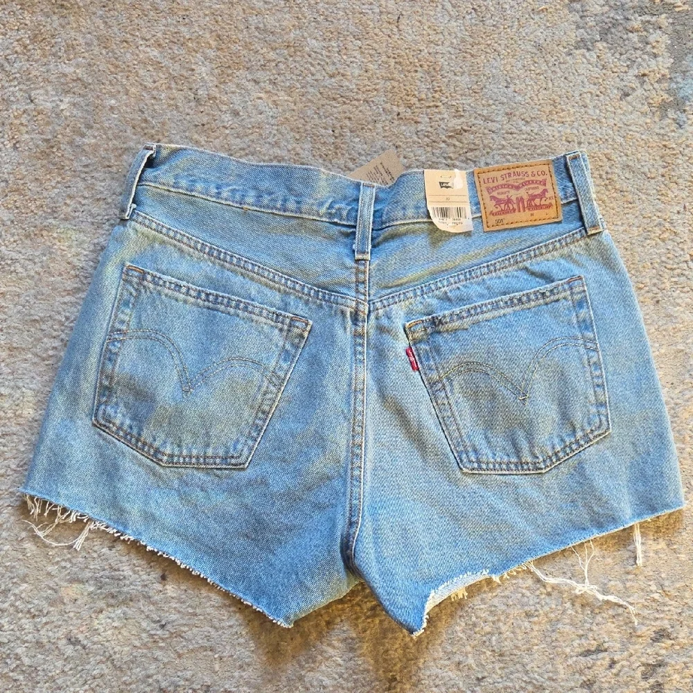 Levi's 501 Light Blue Distressed Jean Shorts‎